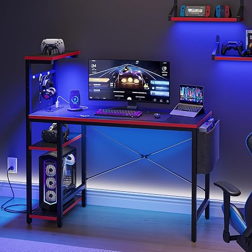 Bestier Gaming Desk with Power Outlets, 44 Inch Led Gamer Desk with 4 Tiers Reversible Shelves, PC Gaming Table with Headset Hook & Side Storage Bag for Bedroom (Black 3D Carbon Fiber)